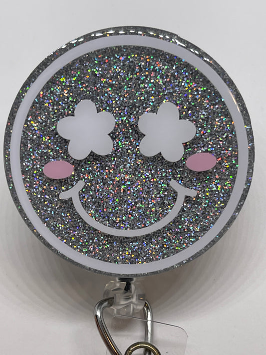 Happy Face with Flower Eyes Badge Reel